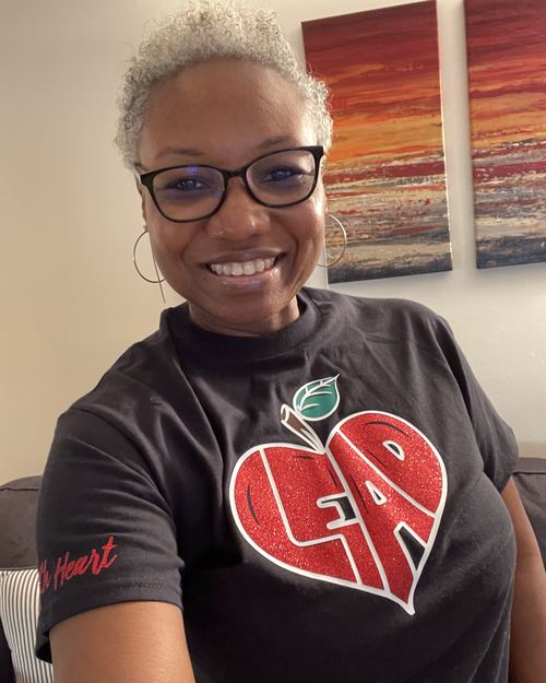 Educator wearing LEAD with Heart shirt