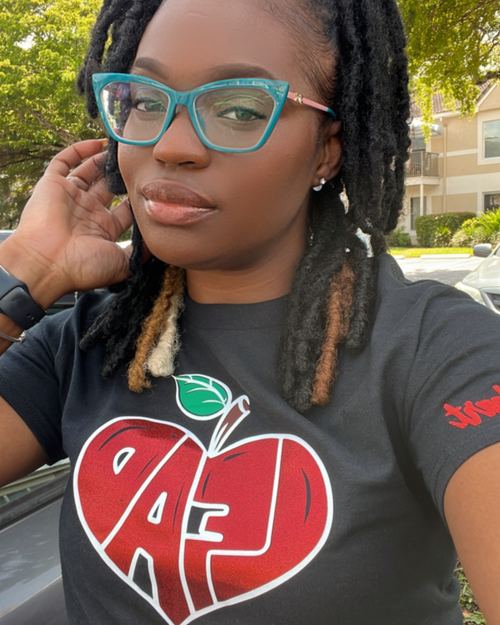 Educator wearing LEAD with Heart shirt