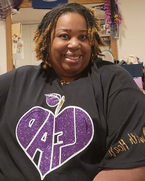 Educator wearing LEAD with Heart shirt