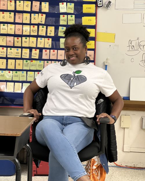 Educator wearing LEAD with Heart shirt