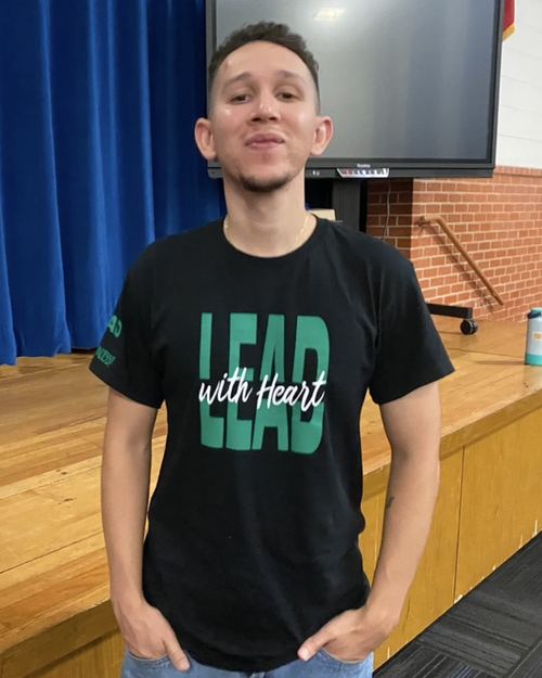 Educator wearing LEAD with Heart shirt