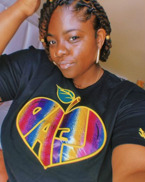Educator wearing LEAD with Heart shirt