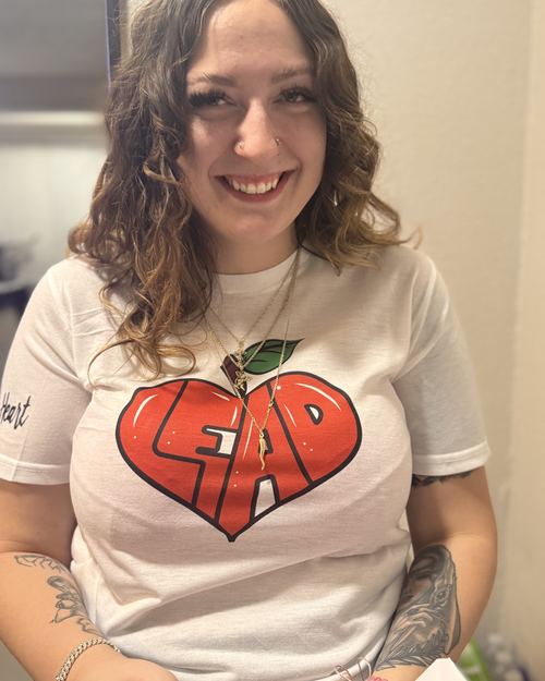 Educator wearing LEAD with Heart shirt