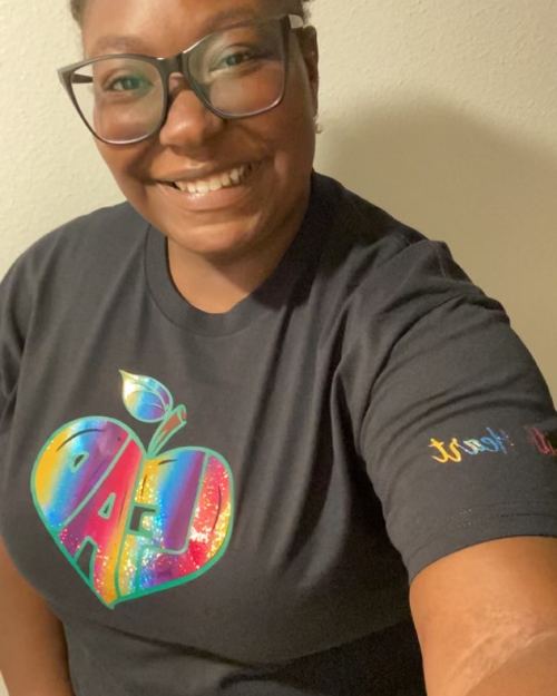 Educator wearing LEAD with Heart shirt