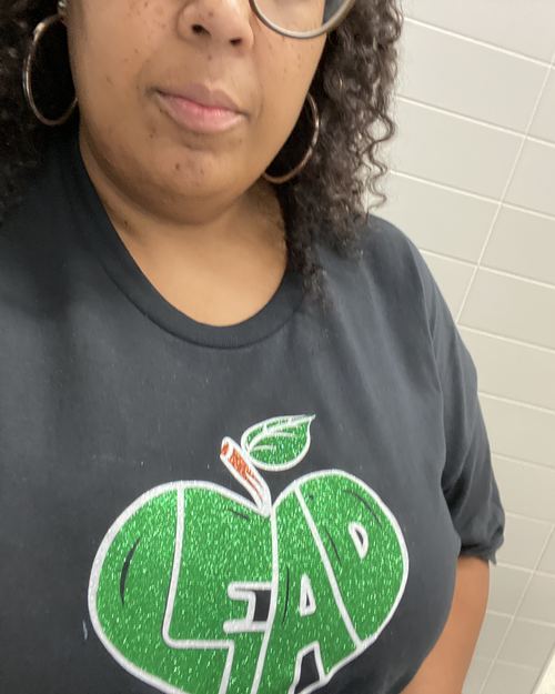 Educator wearing LEAD with Heart shirt