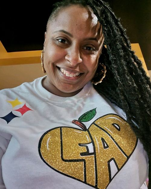Educator wearing LEAD with Heart shirt