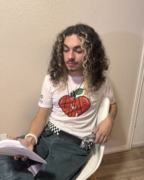 Educator wearing LEAD with Heart shirt
